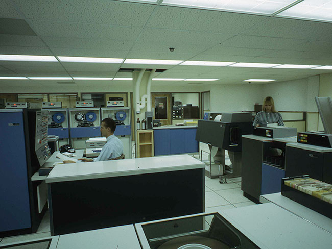 room with computer equipment and medical technicians