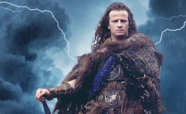 shot of a powerfully built man in a fur cape and kilt standing against a thunderous sky as lightning strikes