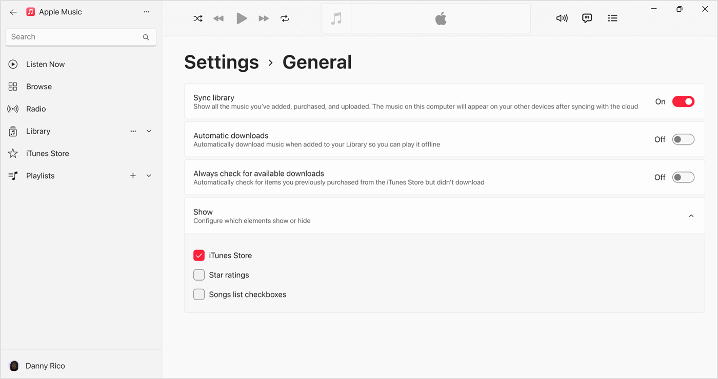 Programa „Apple Music“, skirta „Windows“, kurioje rodoma dalyje „Settings“ (nuostatos) &; „General“ (bendra) įjungta funkcija „Sync Library“ (sinchronizuoti biblioteką) 