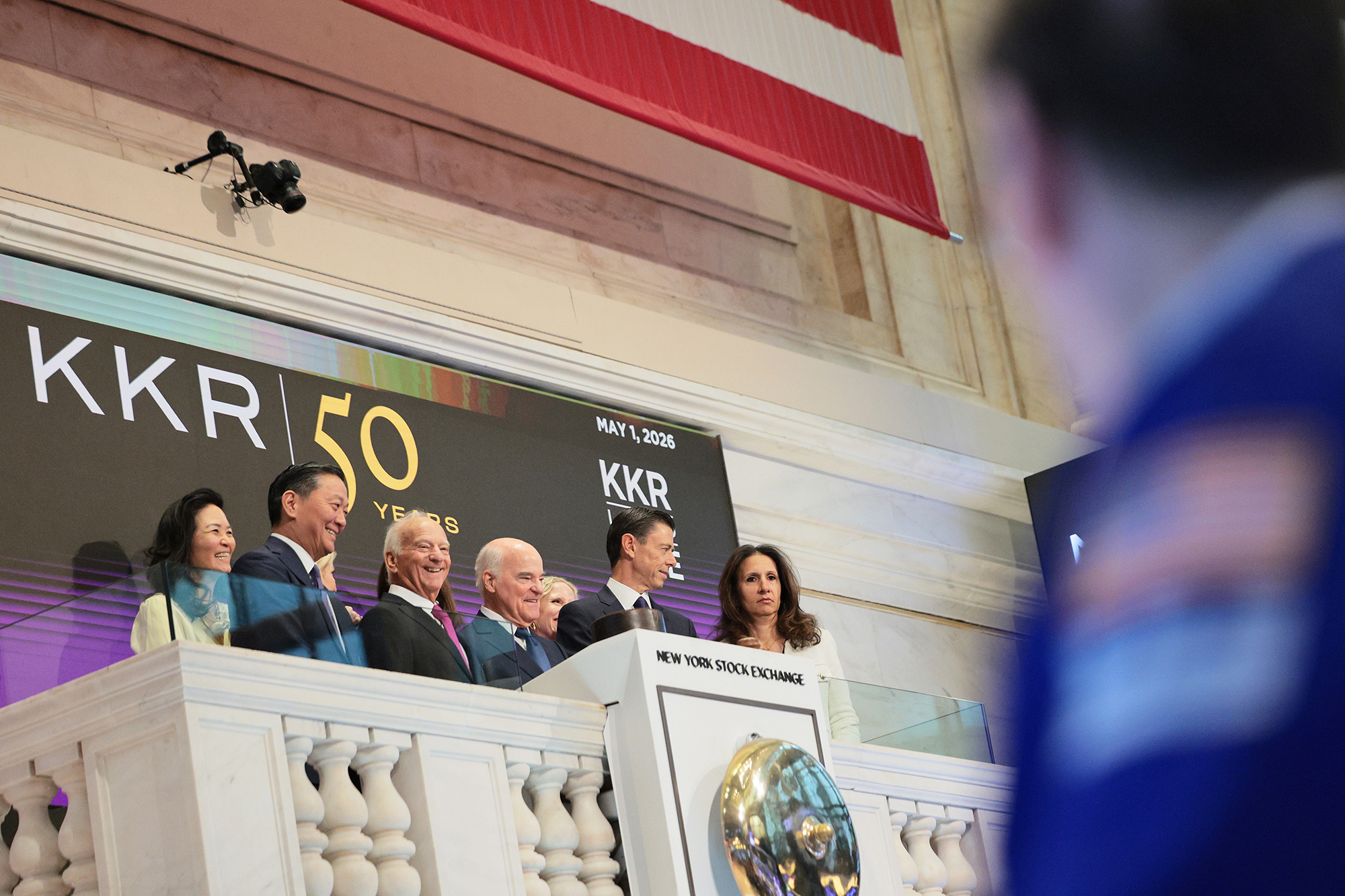 KKR's Joe Bae (from left), George Roberts, Henry Kravis, and Scott Nuttall, celebrate after ringing the opening bell the New York Stock Exchange on May 1.