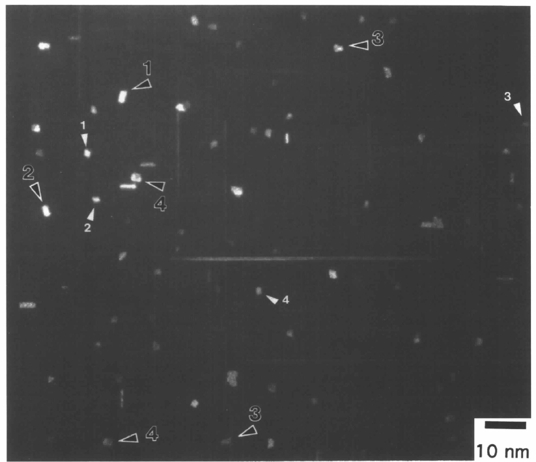 Fig. 2. Dark-field image formed by the diffuse scattering. The electron beam is parallel to the [001] aluminium axis. The white features are the traces of the hardening precipitates. The white lines are parallel to the [100] and [010] aluminium directions. The white and black arrows indicate the two types of small traces with almost rhombic and parallelogram sections. The labels correspond to different variants for each kind of precipitate.  With respect to the long and short traces, they cannot correspond to the same precipitates as the previous small traces because the section of the latter is too small, as mentioned above. Besides, there are no other  The precipitate morphology can be deduced from these traces. Since the almost rhombic and parallelo- 