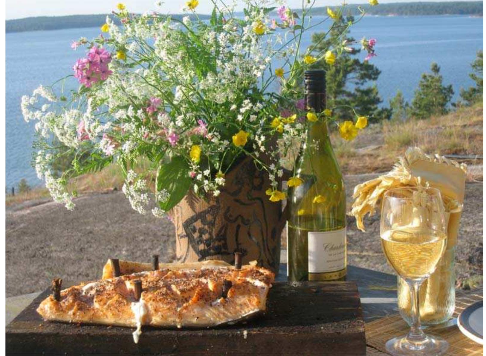 The Crucified Salmon is served with cooked potatoes and white dry white wine. If possible it should be eaten outside by the lake or ocean. At home in the city environment we enjoy grilled salmon often with homemade sauce (see Photo 2). 