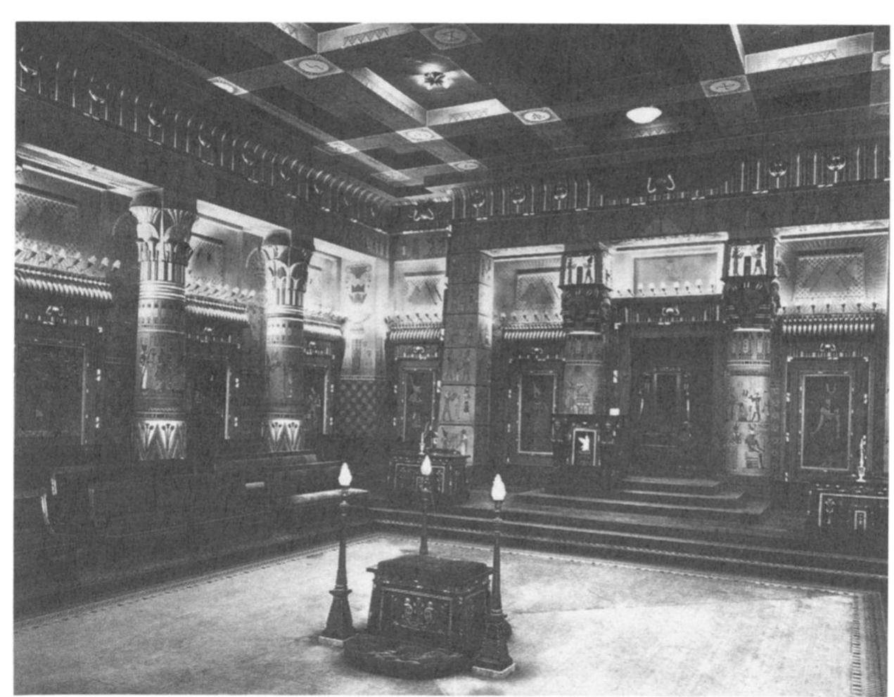 An understanding of the lodge room as theater is further advanced when it is realized that the rituals often were performed by members in elabo- rate costumes and makeup. In performing the fellowcraft ritual of the second degree in 1928, for example, Pacific Lodge No. 233 of New York City utilized a team of thirty-one members in full cos- tume, representing a wide range of characters.” At the height of the blossoming of the golden age of fraternalism between 1870 and 1930, scores of companies provided costumes and props for these productions. Among the largest of these firms were the Pettibone Brothers Manufacturing Company of Cincinnati, Ohio, the Ward-Stilson Company of Anderson, Indiana, the Henderson-Ames Company of Kalamazoo, Michigan, and M. C. Lilley & Com- pany of Columbus, Ohio.”  le ey ee, ee, oe a a re: er ee | 
