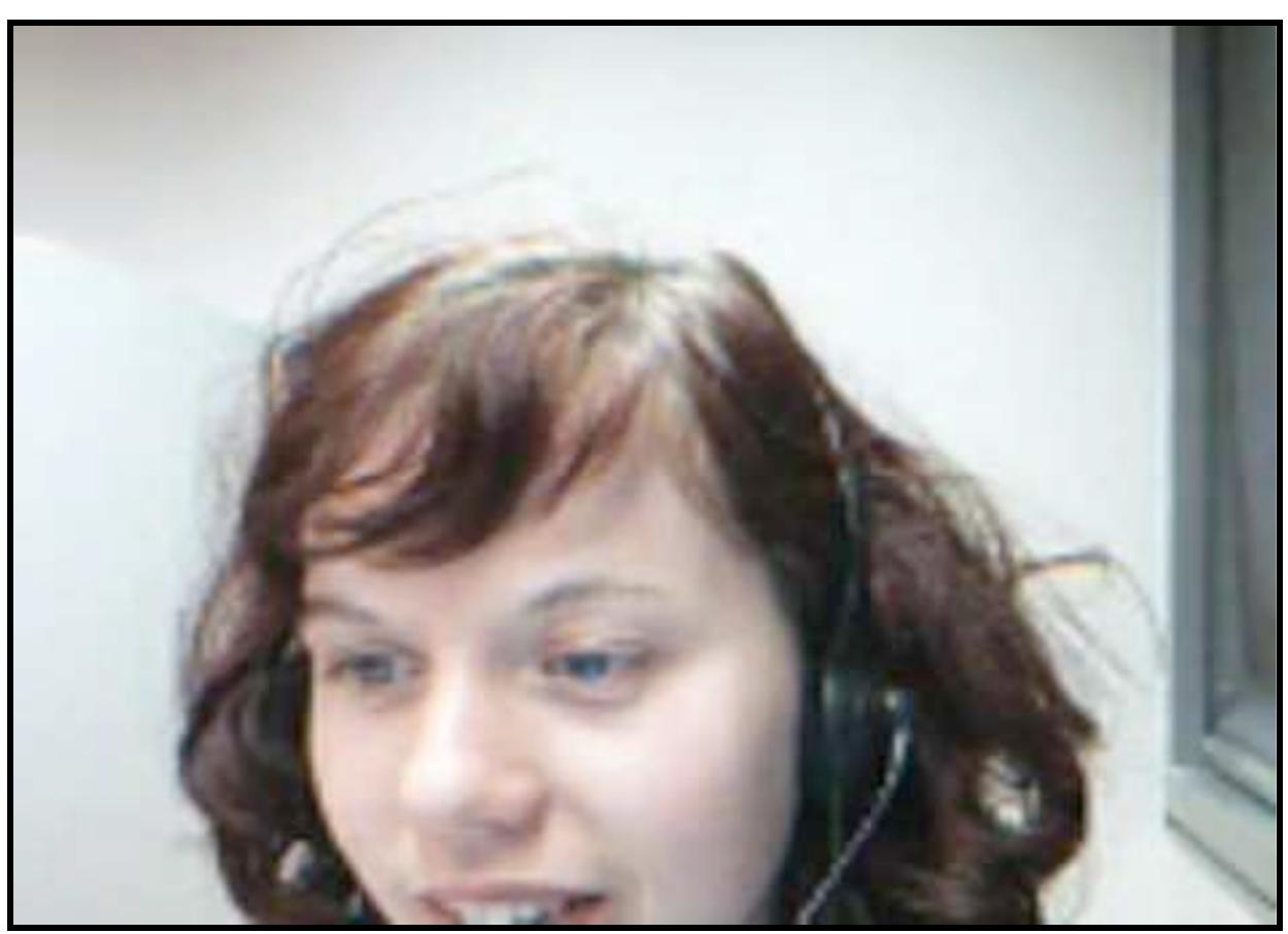 Figure 6.4— Video window capture of Amandine (at 0:26). Amandine addresses Kelly: “Kathy, tu m’entends?”  Amandine: 