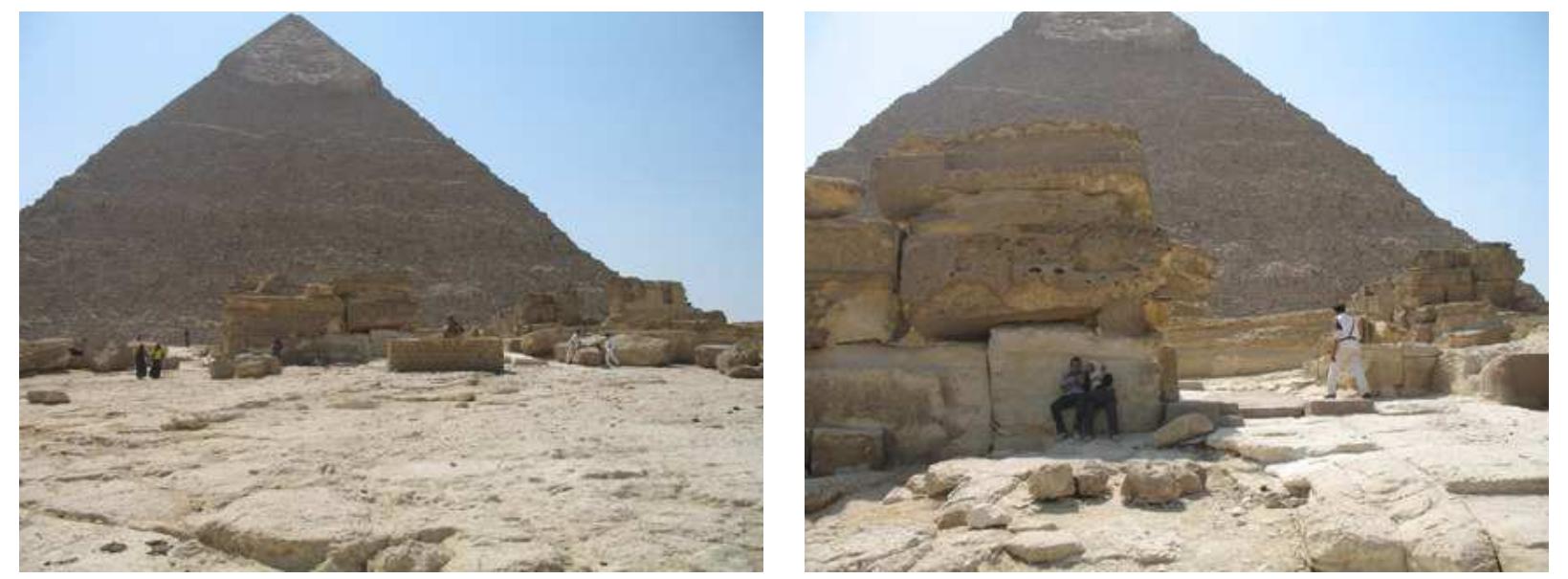 Only one layer of blocks was required to fill this slight depression. Passers-by give the scale of the blocks. At a later date, the bedrock was even dug beneath the causeway.  The Royal Causeway reaches the Upper Temple in the South part of the East face with an angle of 80°. Thus, the entrance is not centered on the East/West axis (in order to reach this shifted entrance, the causeway had to bent slightly at 50 meters from the entrance). 