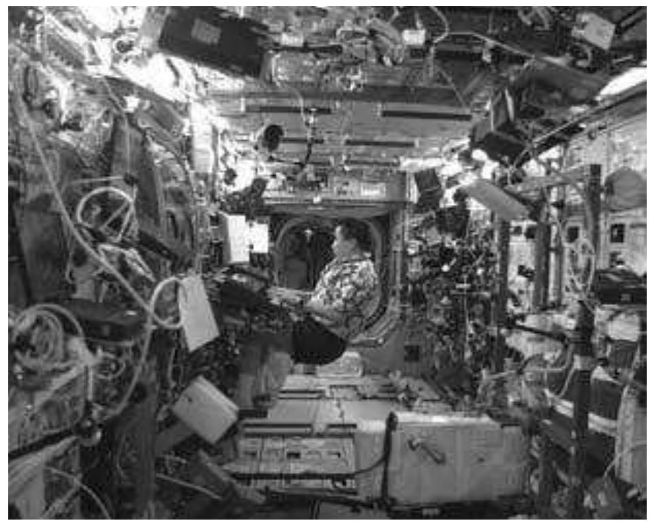accommodations, including the waste management compartment and toilet, the galley, individual sleeping compartments for crew, and some of the exercise facilities, are in the Service Module (SM). A third sleeping compartment is located in the U.S. Lab, and additional exercise equipment is in the U.S. Lab and the Node. Additional habitation capabilities for a crew of six will be provided prior to completion of ISS assembly. °  Fig.2: Interior of the International Space Station” 