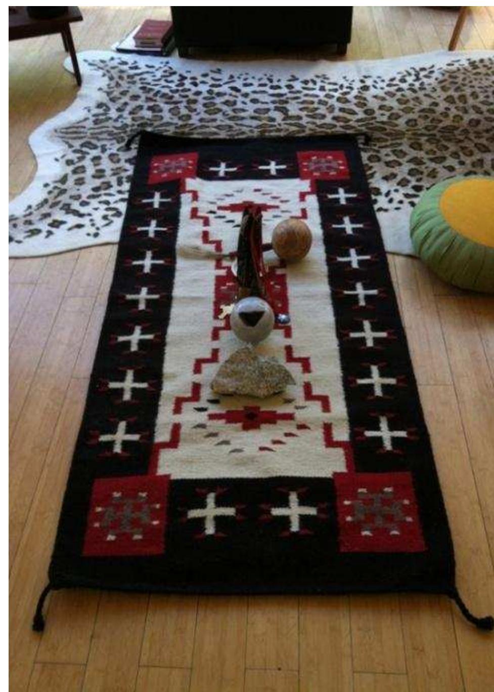 Figure 6. Photo credit Three Eagles, 2016. 2lfhree Eagles’ medicine wheel rug. Navajo Storm design. 