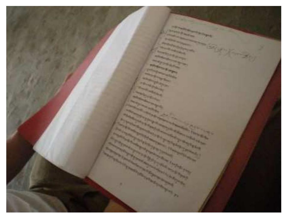 Fig. 3 - A copy of the script in use in rehearsal. Note mark-ups made by elder members of organization. Photo by Kati Fitzgerald on July 23, 2010. 