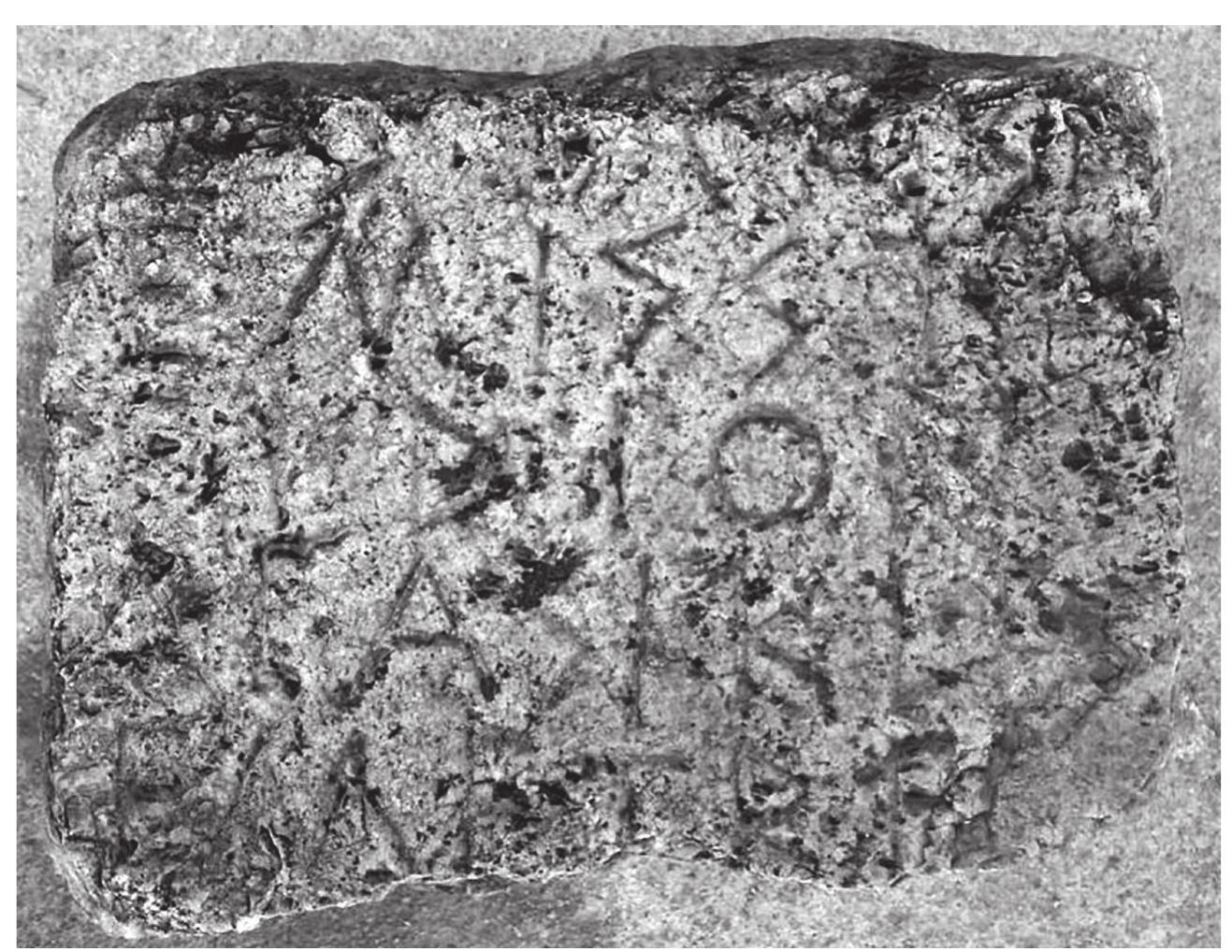 Fig. 4. MO 536 — visibility of lettering enhanced by means of charcoal (photograph by the author). 