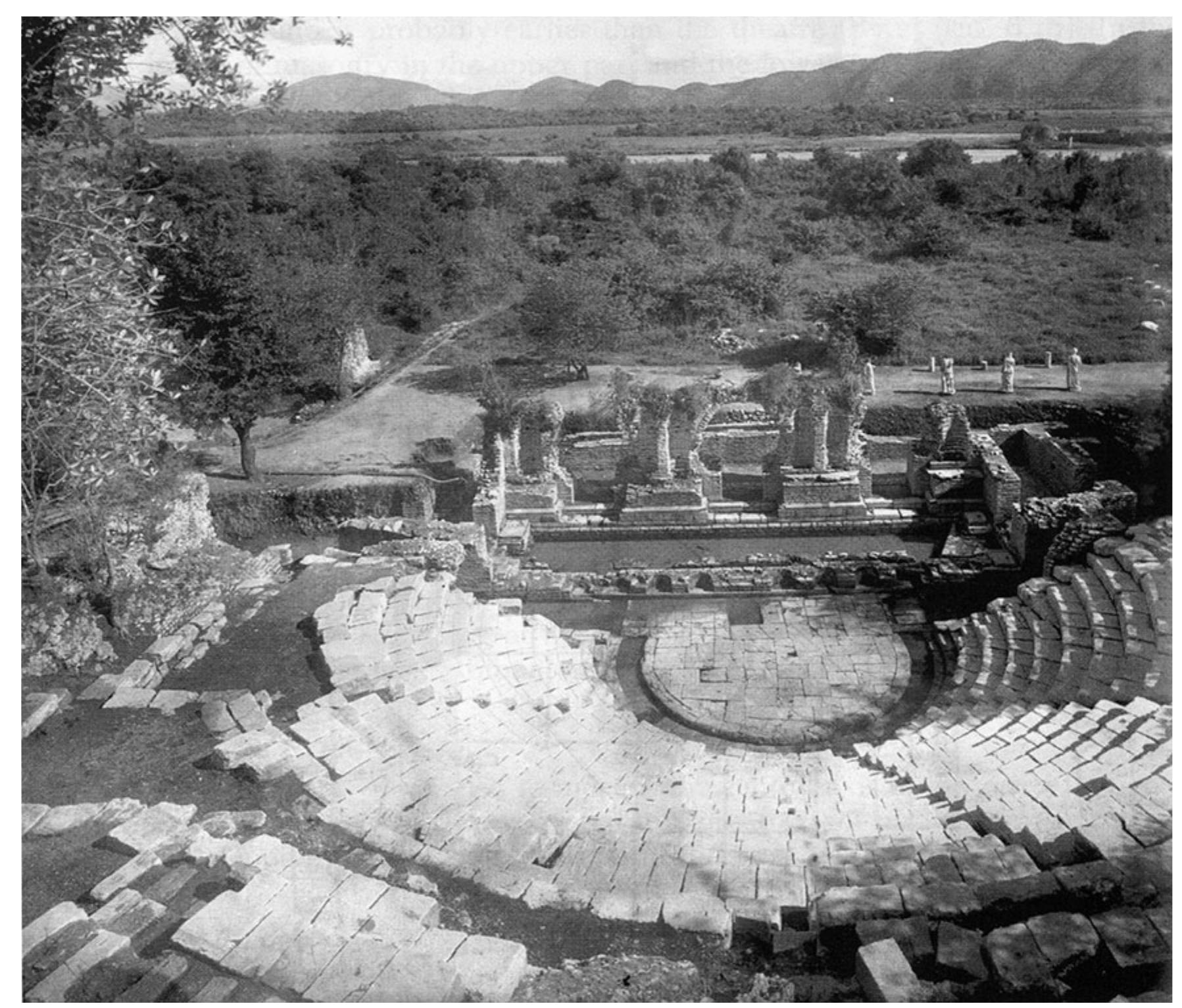 Fig. 6. Ugolini’s post-excavation photograph of the Theatre, 1932 (courtesy of the Butrint Foundation).  Ugolini’s calculation of 30 cm for the fluctuation of the water table corresponds precisely to the tidal range known from modern geological studies (Negroni 2001; Hounslow and Chepstow-Lusty 2004). He took regular measurements of the water table, and this factored into his excavation plans in the lower city (Ugolini 1942, 12-19). For example, he measured the water level at the Vivari channel and at the Theatre on 19 July 1930 at 9.30 a.m. (Ugolini 2003, 79). In short, Ugolini discloses that the water table was the reason why he chose to abandon his search for the Forum (Ugolini 1942, 13). He thought that the undertaking would be too expensive, difficult and long, involving the development of cumbersome hydraulic systems to combat groundwater. It has gone unnoticed that Ugolini was pursuing a master plan at Butrint: to excavate the entire area between the Theatre and the Baptistery by extending the trench at the Theatre eastward (Fig. 3) (Ugolini 1937, 59-60). Had he succeeded, he would have discovered the Forum. Ugolini’s trench ultimately reached no further than the eastern end of the Peristyle Building and the Roman Bath. Sea level terminated Ugolini’s enterprise. 