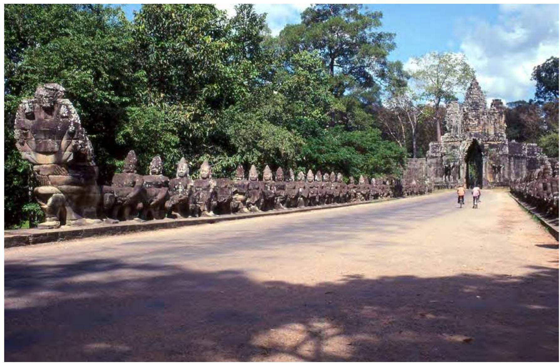 The southern gate portal and bridge balustrade at Angkor Thom Cambodia. The portal gate is in the process of being 'churned' by the Devas and the Asuras either side of the bridge balustrades. 