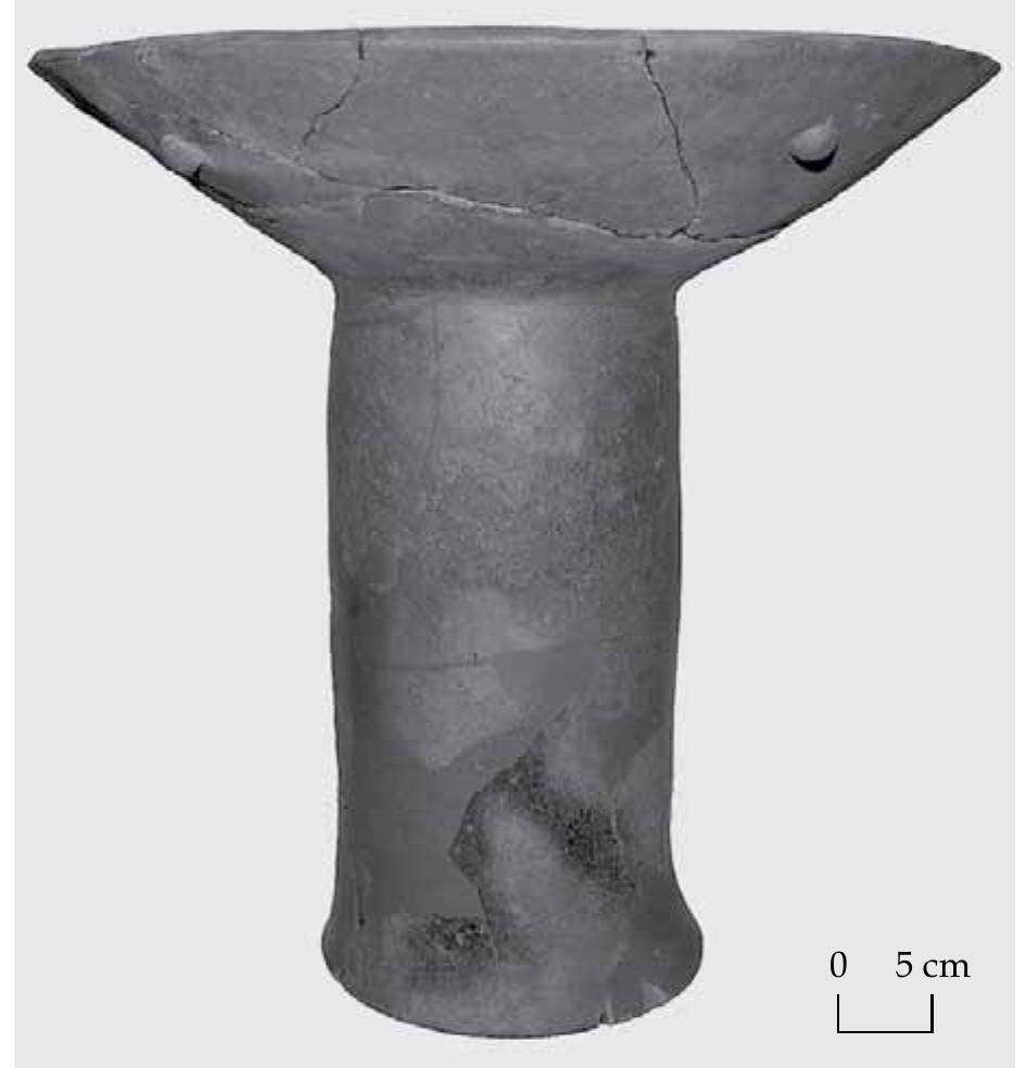Fig.6 Large, refitted and restored pedestalled bowl from Feature 58.  Refuse pits 