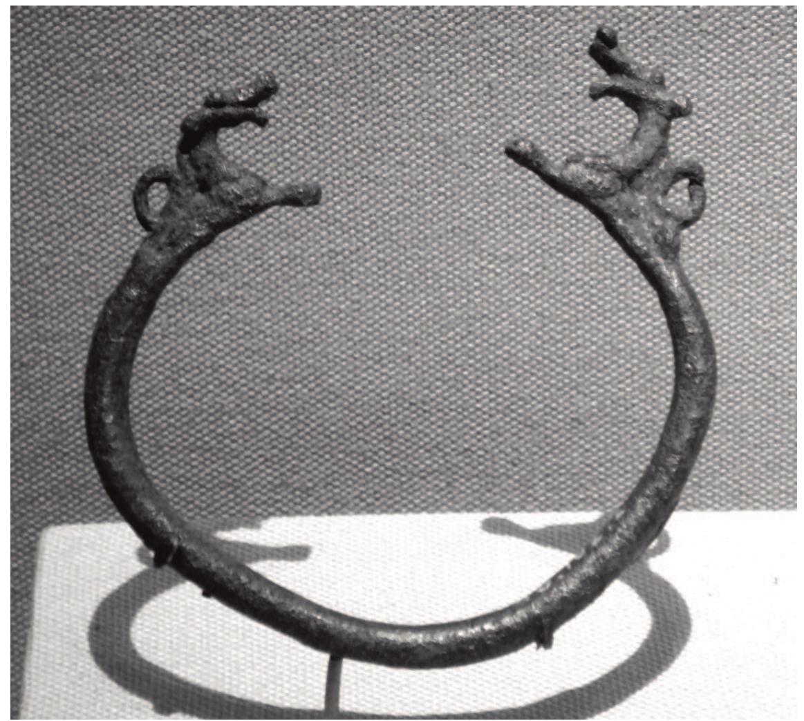 Ficure 5: Bracelet with animal terminals from Surkh Dum, Iran, ca. 8th-7th century BCE. Bronze; diam. 8.3 cm. New York, Metropolitan Museum of Art 43.102.2 (photographed by the author).  Although removed in time from the Achaemenids by several centuries at least, these bracelets point to an older tradition of lion-headed bracelets in what 