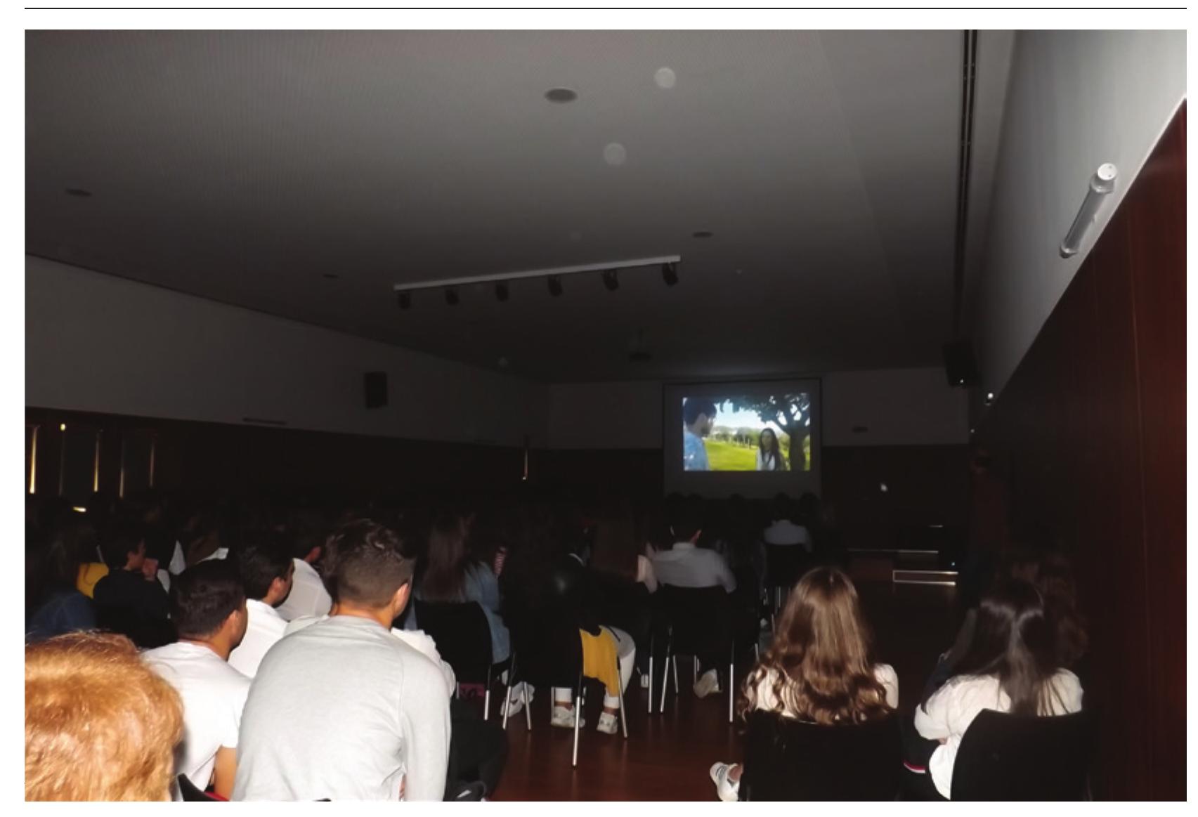 Figure 5: Students’ final presentation  While students were initially expected to have access to a computer and editing software, the delay in the arrival of this equipment and the time constraints of the project meant that there was insufficient time to teach students all the various tools and possibilities of film editing, leaving tutors to take over the technical editing of the films on their own computers. We tried to surpass this limitation by asking each group to produce an editing script that reflected their autonomous decisions on how they wished their films to be edited. Hence, tutors merely executed each team’s decisions on which shots to use, the ‘in’ and ‘out’ timecodes for each selected shot and their order, what live sounds and visual/sound effects and music to include, which transitions to apply between shots, and what the final credits of the film were. In this way, students’ responsibility and autonomy in editing their films were partially adhered to. 