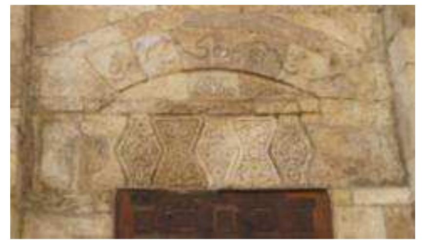 Figure 9: Lintel, nafis and relieving arch with various floral decoration carved on stone- Facade window of al-Salih Najm al-Din Mausoleum. 