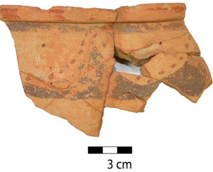 Figure 7. Bichrome-painted krater from Katsingri, provenance Aegina (figure author).  By combining our observations of the Katsingri material, we can reach some new conclusions. Of all the NAA-analysed EMP fragments, those that show crackled paint and consist of buff grey-brown to greenish clay have the same chemical fingerprint: that of an origin on Aegina. Mountjoy identified a group of LH IIA pottery that links the ceramic manufactur- ing practices of Aeginetan workshops with the ones in the Northeast Peloponnese. 