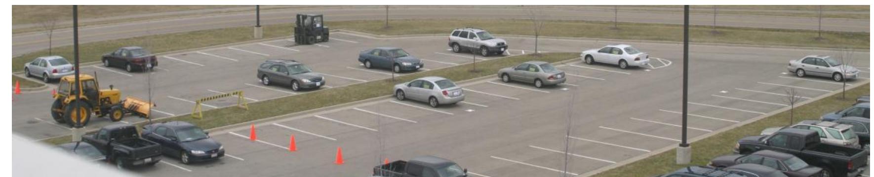 Figure 2. Digital picture reference of parking lot consisting of vehicle staging center. All nine personal-owned-vehicles, case tractor and forklift displayed. 