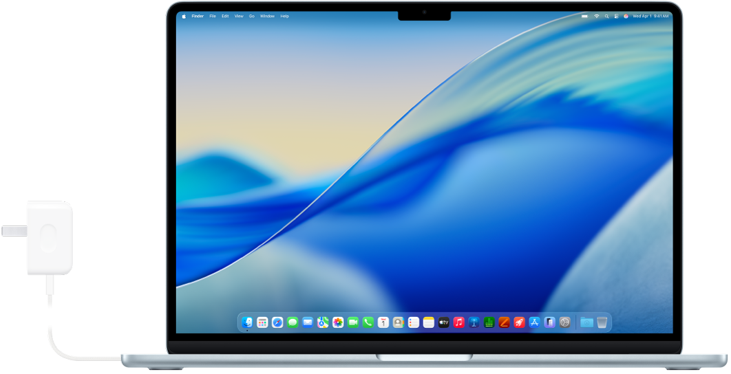 Una MacBook Air con el adaptador de corriente conectado.