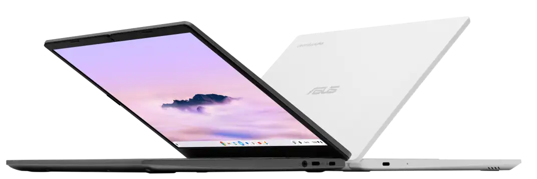 A black Chromebook and a white Chromebook are partially open and sitting back-to-back.