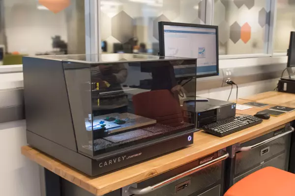 Makerspace | An image of a student working with the TFDL 3D printer