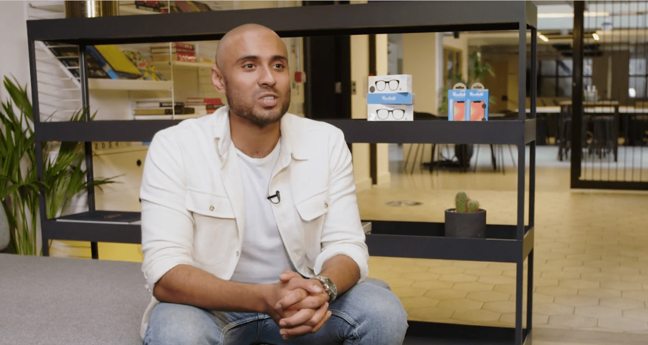 video poster image of an event presenter on stage