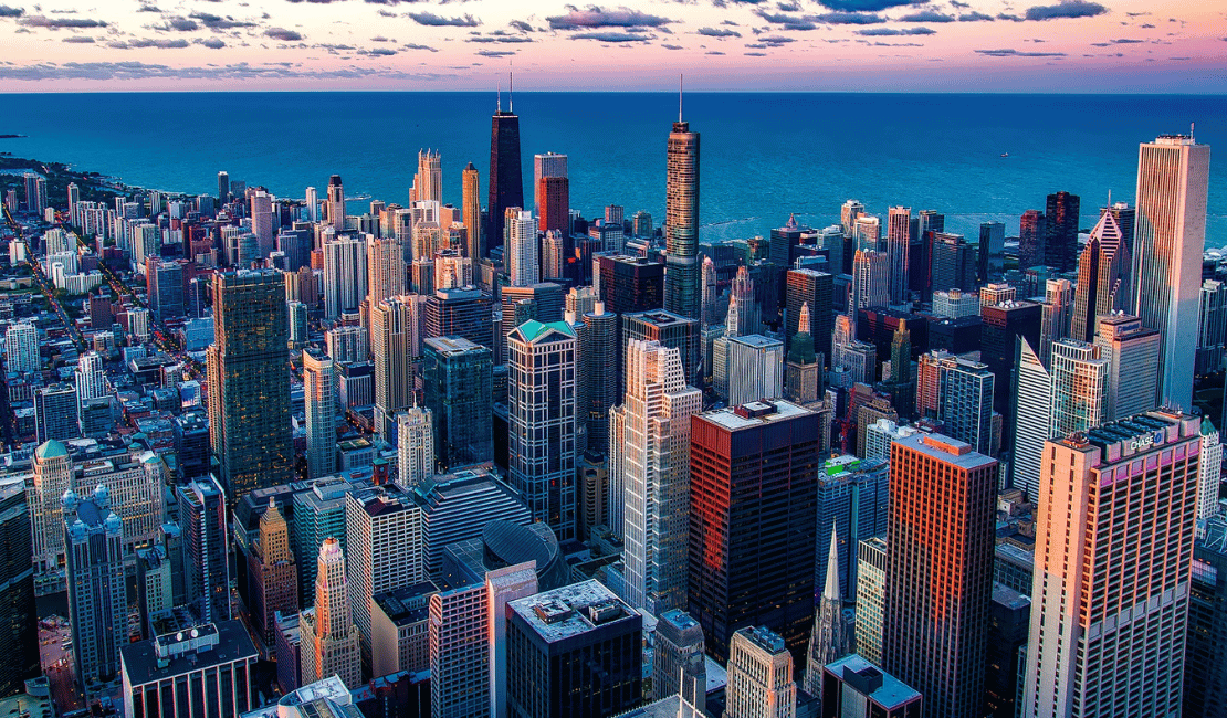 Aerial view of Chicago skyline with Lake Michigan in the background.