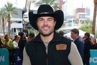 Steven McBee Jr. smiling outdoors in front of fans at BravoCon 2025.