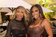 Porsha Williams poses with mom Diane Williams at a restaurant.