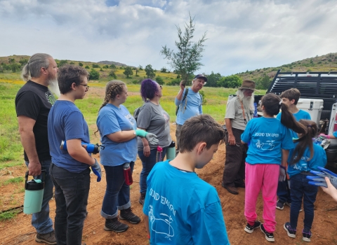 Kids listening to an outdoor talk