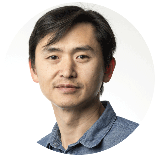 A headshot of Che-Bin Liu, Director of Software Engineering at Socure. He has short black hair and a moustache, and a serious expression.